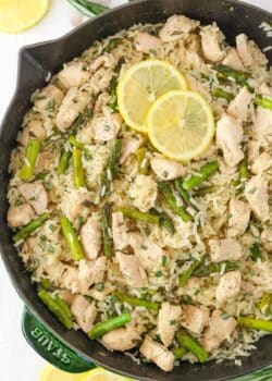 Top view of a skillet of lemon rosemary chicken and rice.